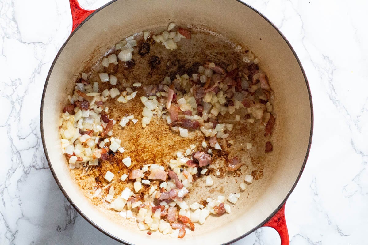 frying bacon and onions for chorizo soup