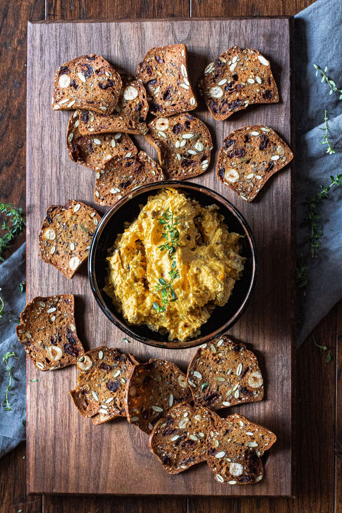 Goat cheese appetizer with raincoast crisp crackers garnished with fresh thyme