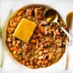 Crockpot ham and beans served with cornbread.