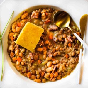 Crockpot ham and beans served with cornbread.
