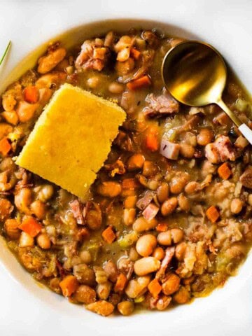 Crockpot ham and beans served with cornbread.