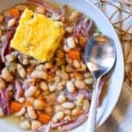 Crockpot ham and beans served with cornbread.