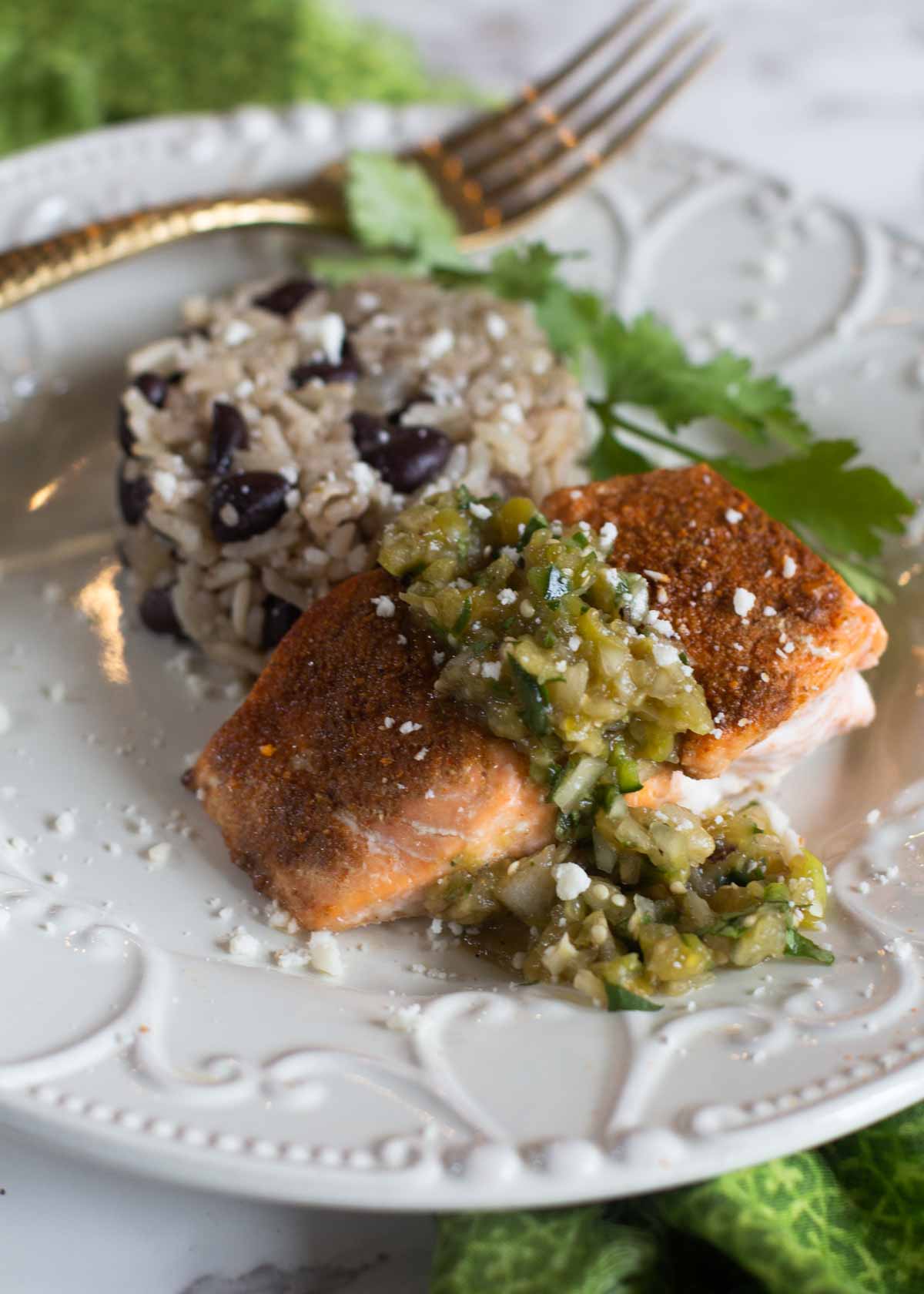 Salmon fillet roasted with Mexican spices and served with black beans and rice.