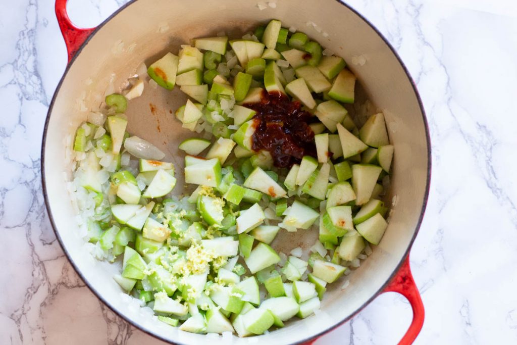 Adding chipotle sauce to sweet potato soup