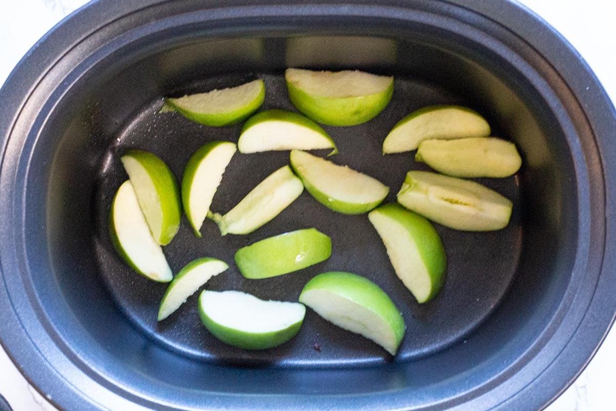 green apples in slow cooker for Pork Chops with Apples.