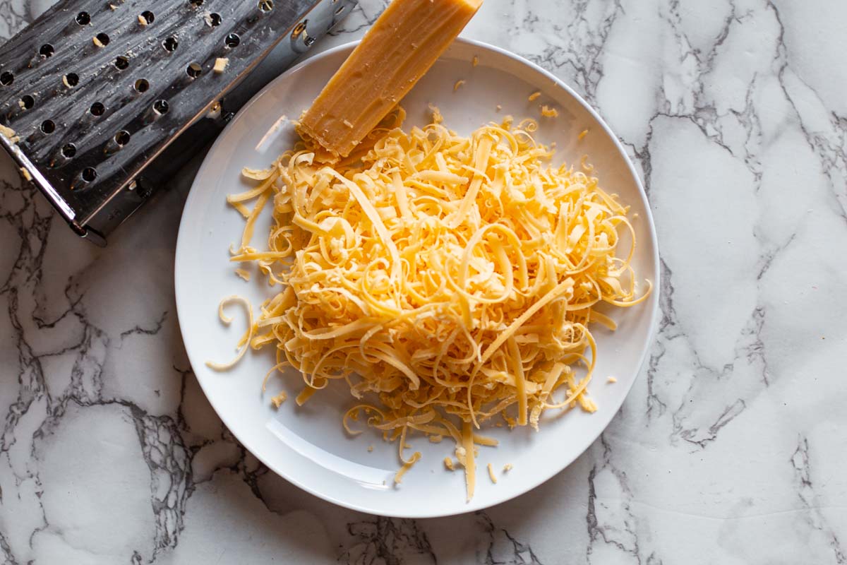 Grated cheese for pulled pork enchiladas