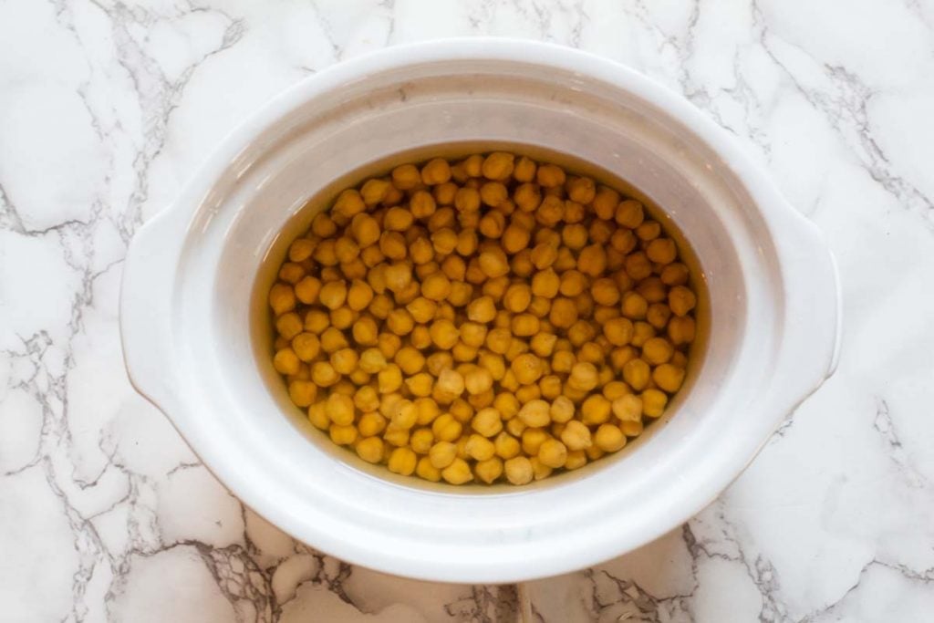 soaking dried chickpeas to make hummus