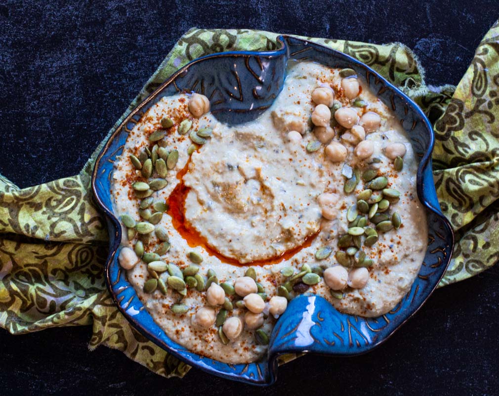 Spicy Hummus Recipe made with Hatch Green Chile Peppers, topped with pepitas and chickpeas
