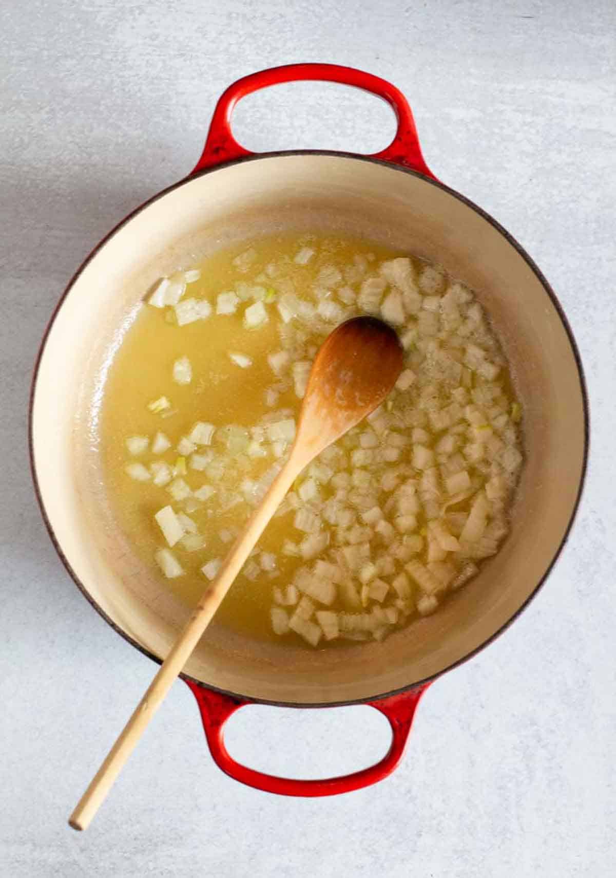 Cooking onions to make Flemings Steakhouse Chipotle mac and cheese.