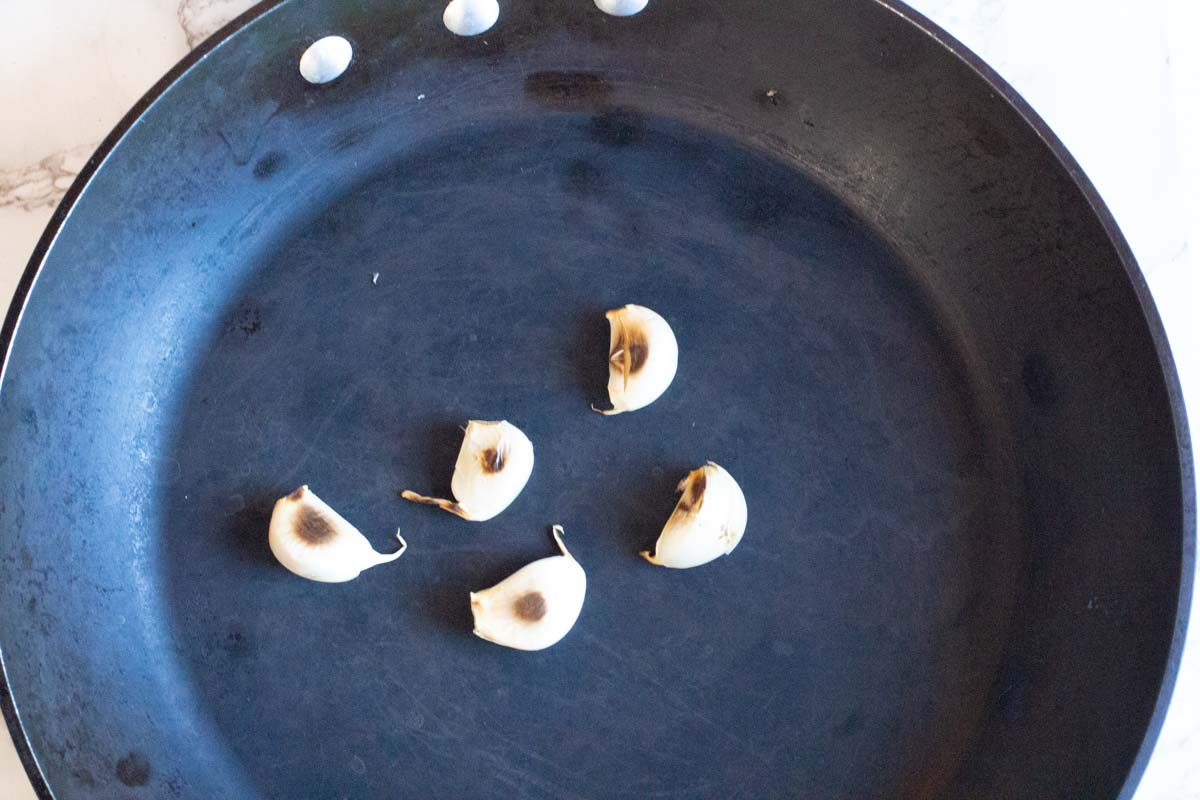 toasting garlic for pibil enchiladas