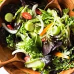 Accompaniment salad in a wooden salad bowl.