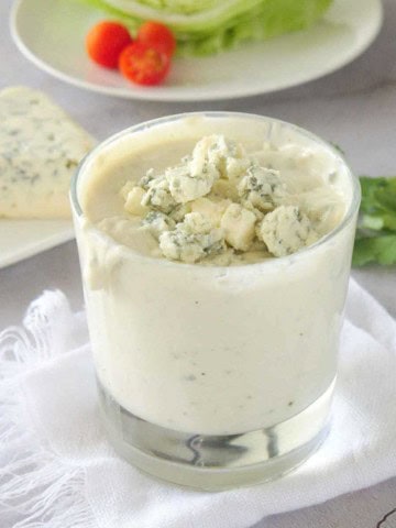 A container of homemade blue cheese dressing.