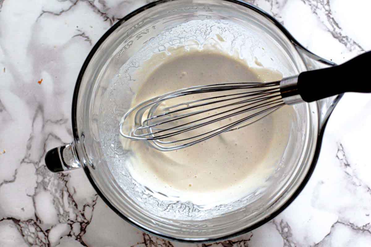 Adding sour cream and mayo to make homemade blue cheese dressing.