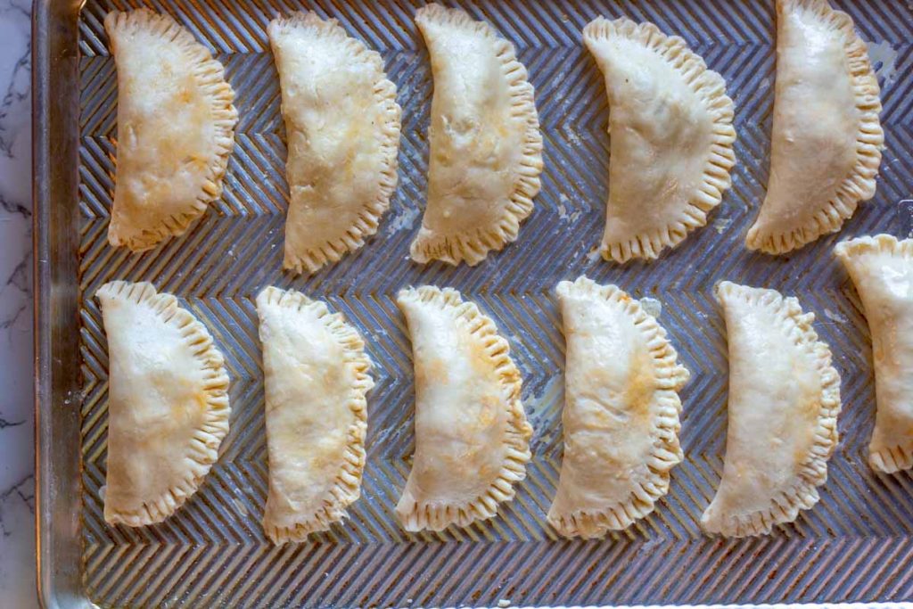Empanadas made with cream cheese dough ready to bake