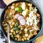 New Mexico Pork Posole topped with sliced radishes and grated cheese.