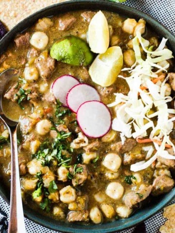 New Mexico Pork Posole topped with sliced radishes and grated cheese.