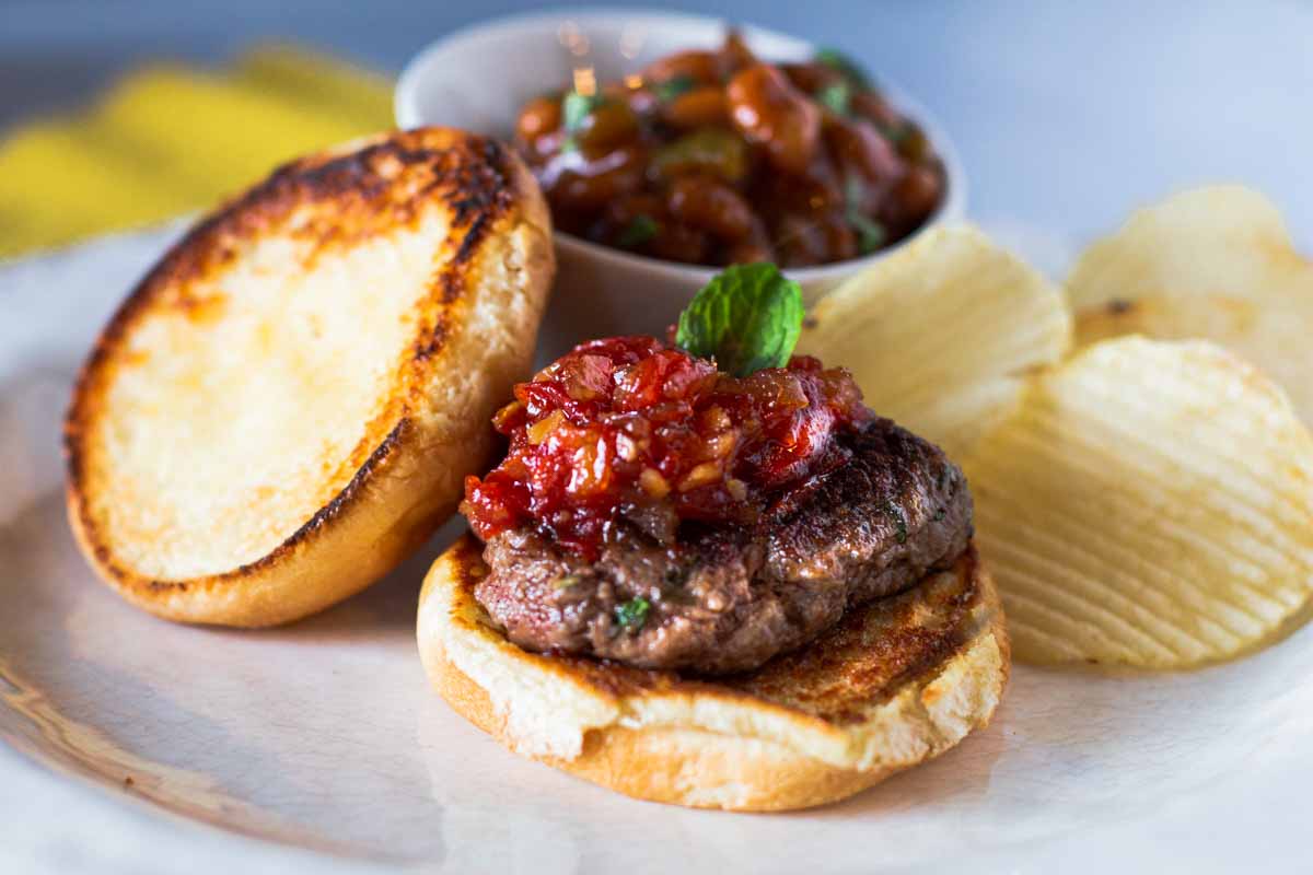 Lamb burgers with mint and topped with Tomato Chutney. Served with Baked beans