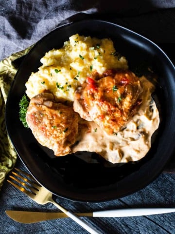 Braised chicken thighs with creamy tequila sauce served with polenta