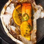 A salmon fillet cooked in parchment paper with Southwestern spices.