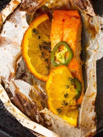 A salmon fillet cooked in parchment paper with Southwestern spices.