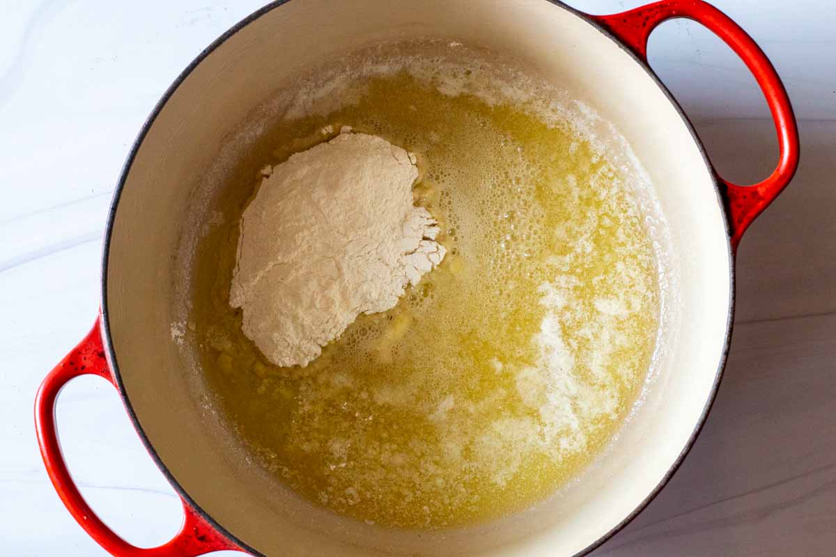 making a roux for macaroni and cheese with butter and flour