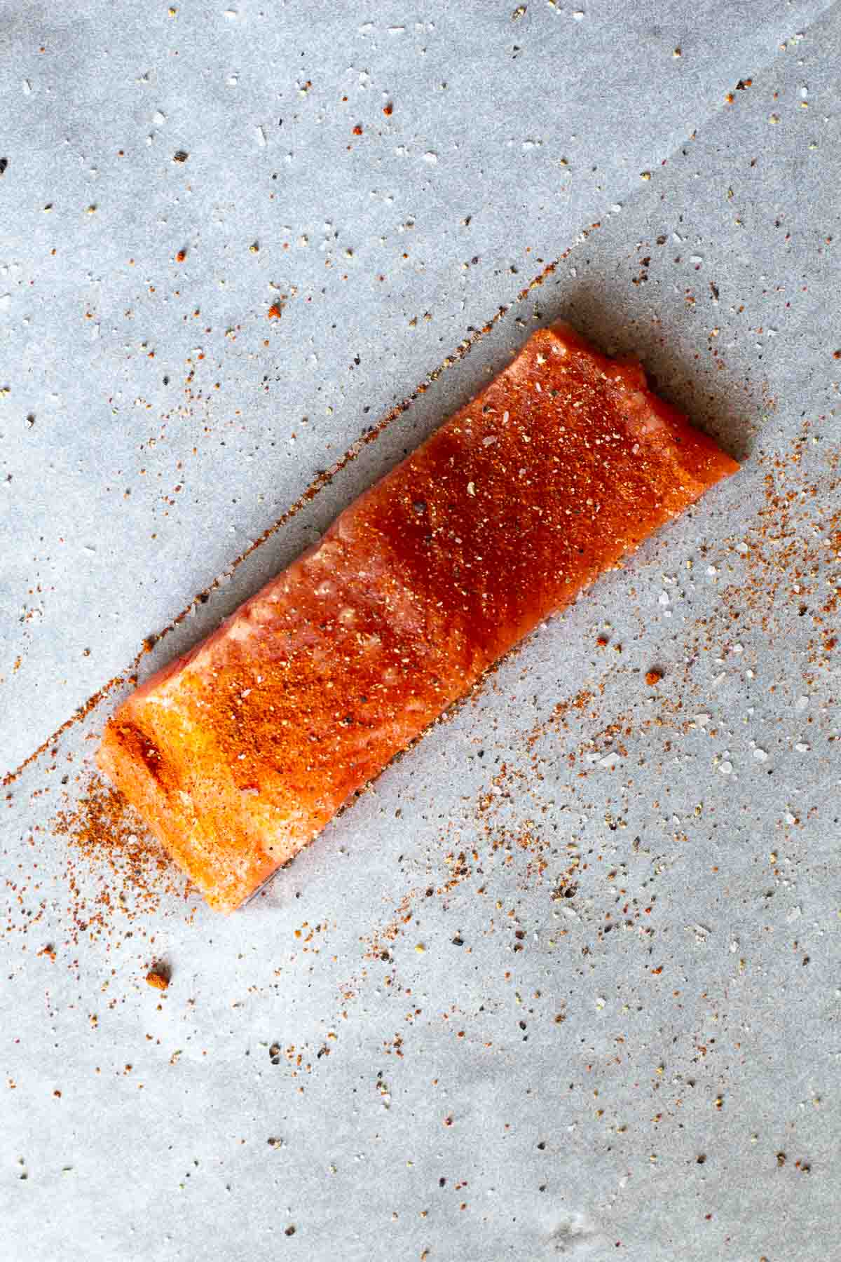 Step 2 seasoning salmon to make salmon in parchment paper.