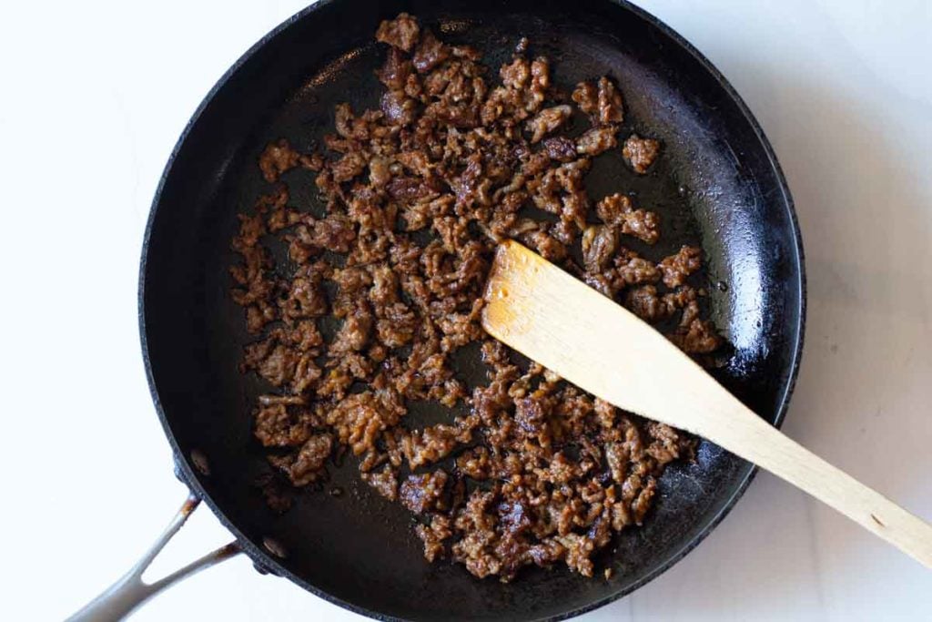 browning chorizo in a fry pan