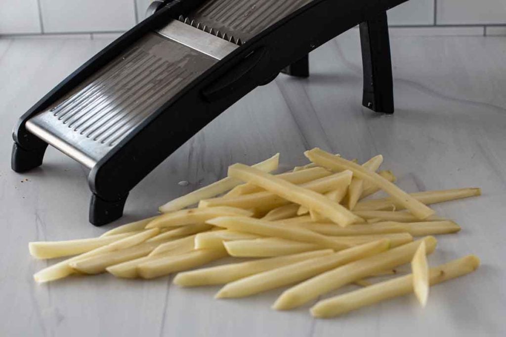 Cutting french fries with a mandolin