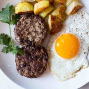 Homemade ground turkey sausage served with potatoes and eggs.