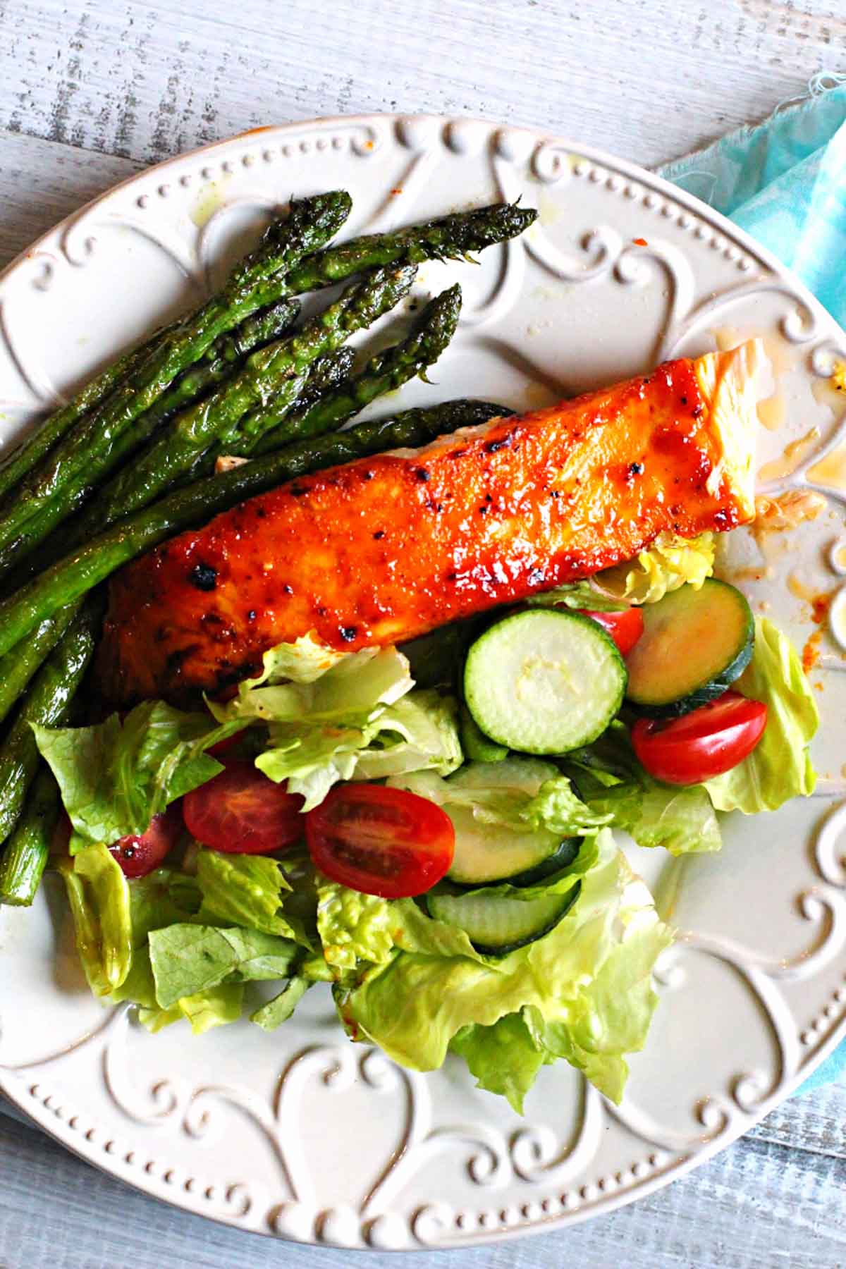Peach Jam Glazed Salmon with a tossed green salad and sauteed asparagus.