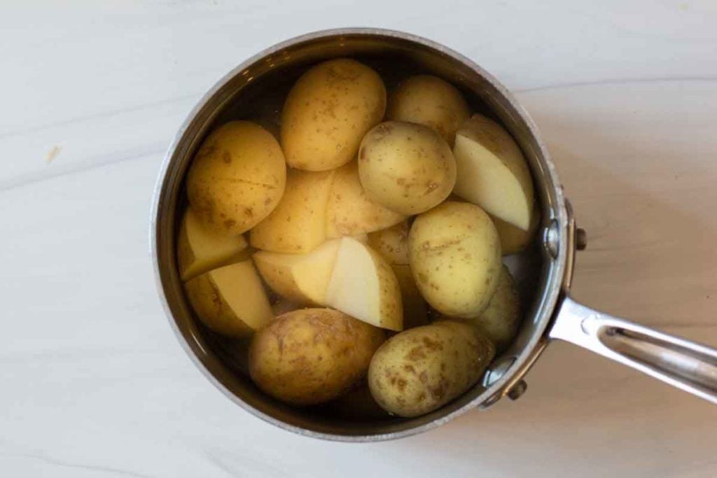 boiling yukon gold potatoes in a saucepan
