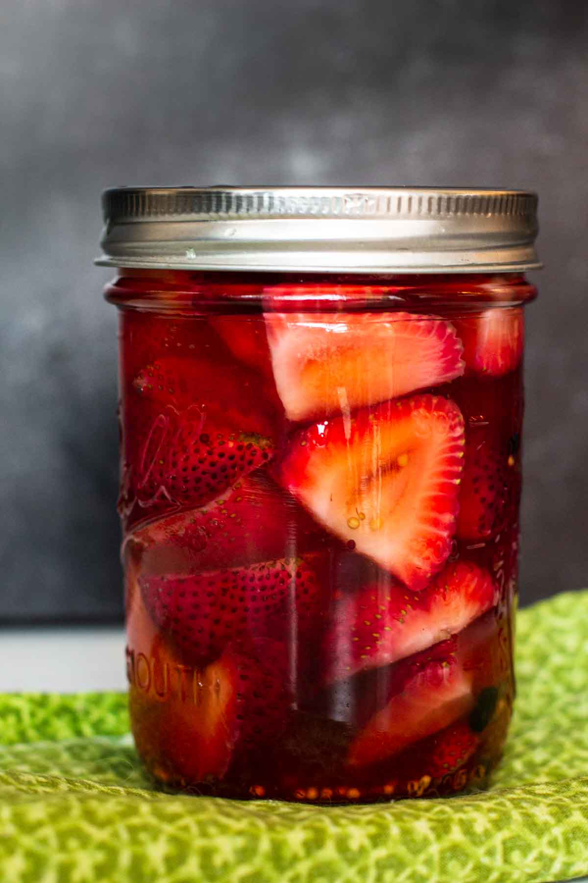 Pickled strawberries in a canning jar