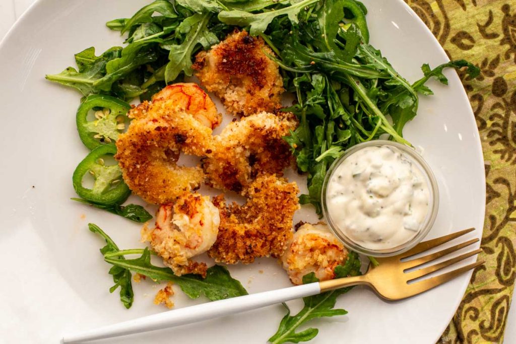 Baked shrimp breaded with panko and served with jalapeno lime aioli and arugula