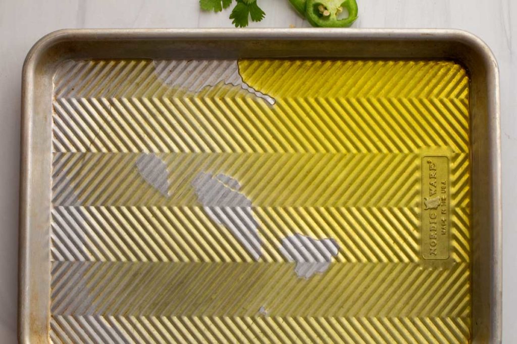 Baking sheet drizzled with olive oil