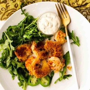 Panko breaded baked shrimp served over arugula.