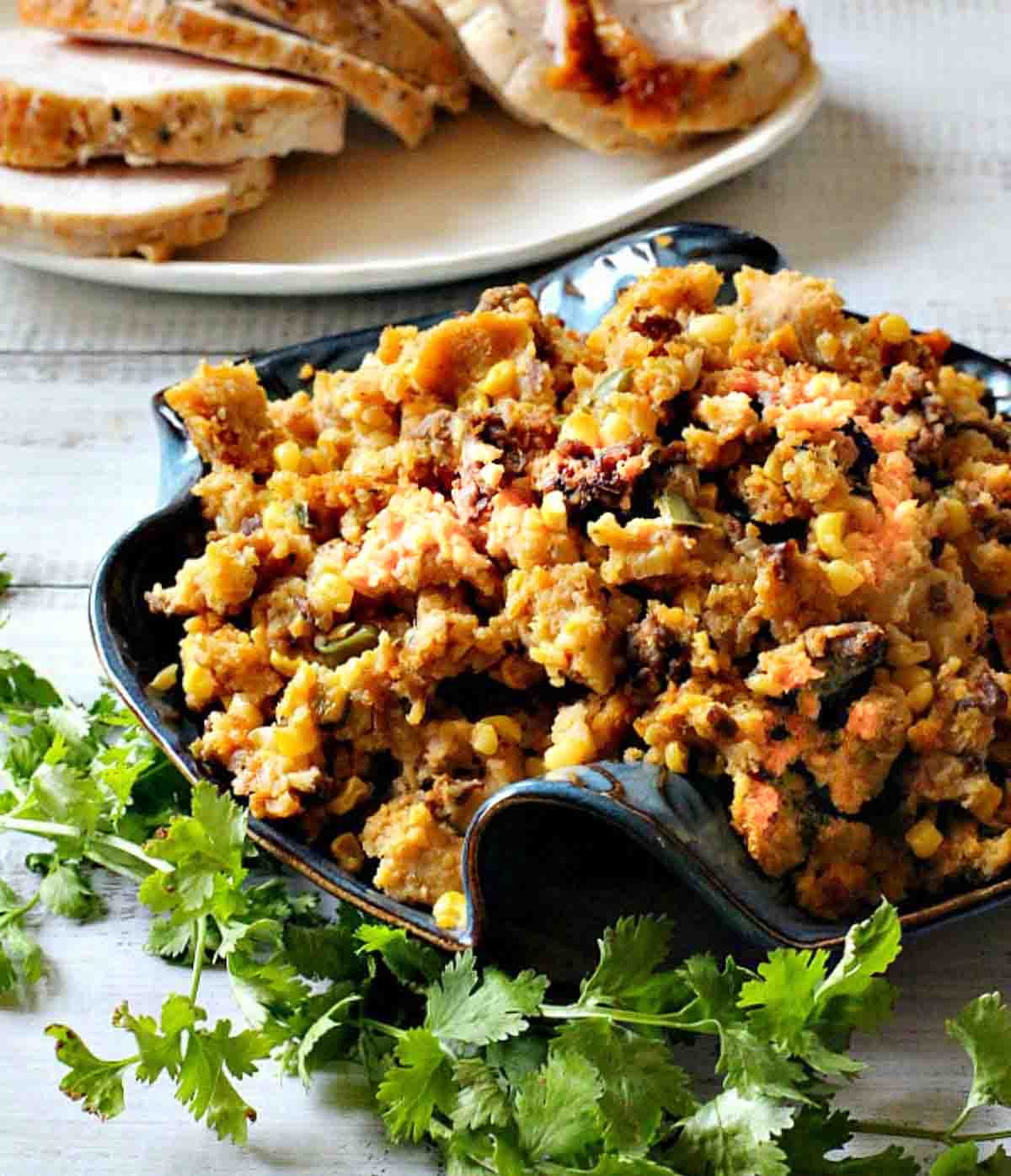 Thanksgiving chorizo stuffing made with cornbread and served with turkey breast.
