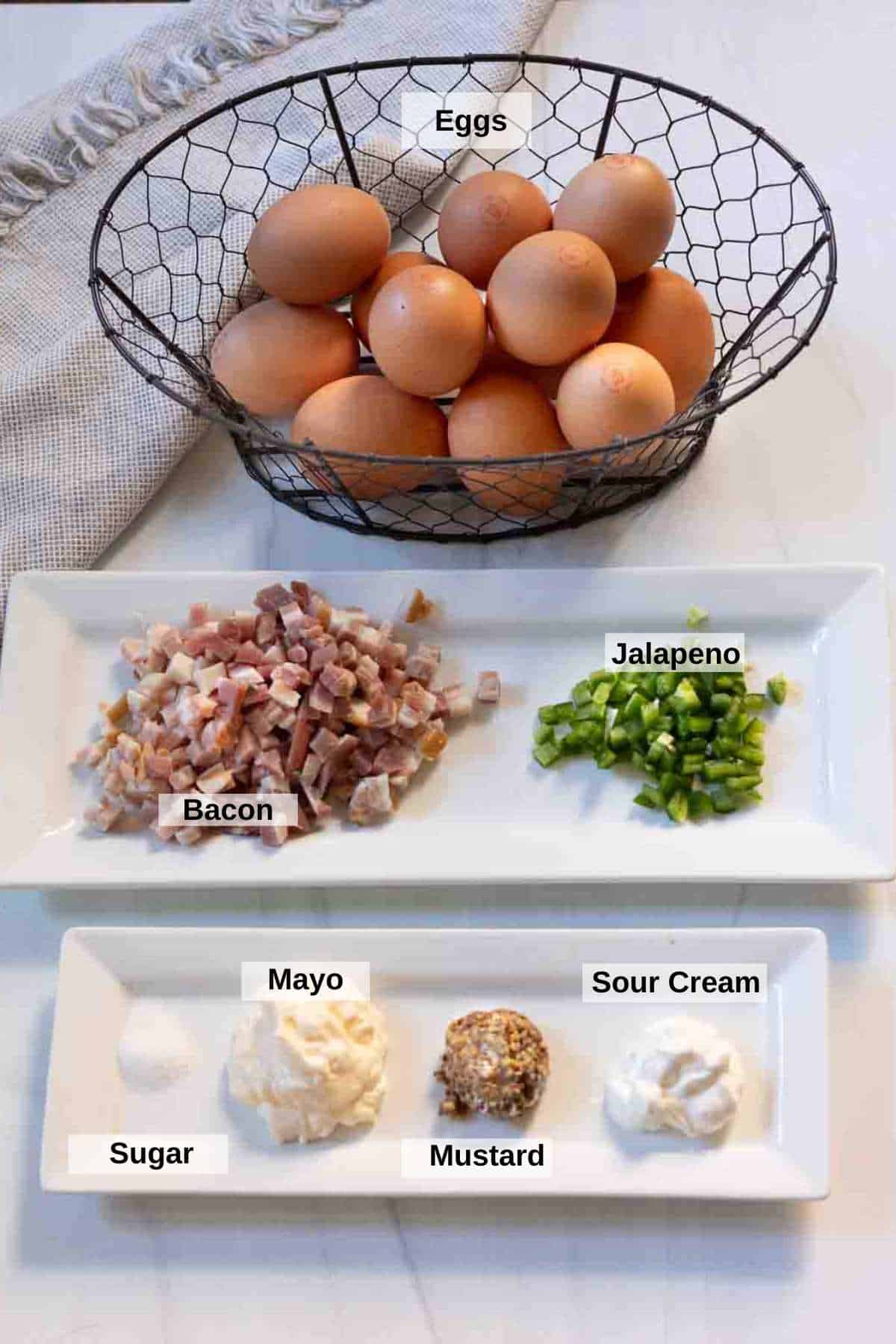 Ingredients to make deviled eggs with bacon and jalapeno.
