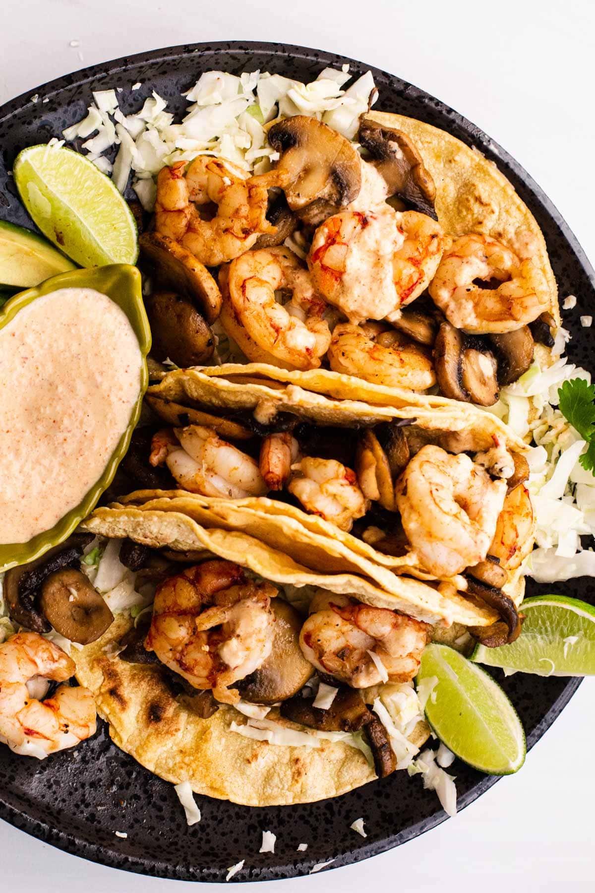 simple shrimp and mushroom tacos on corn tortillas with a creamy pineapple salsa.