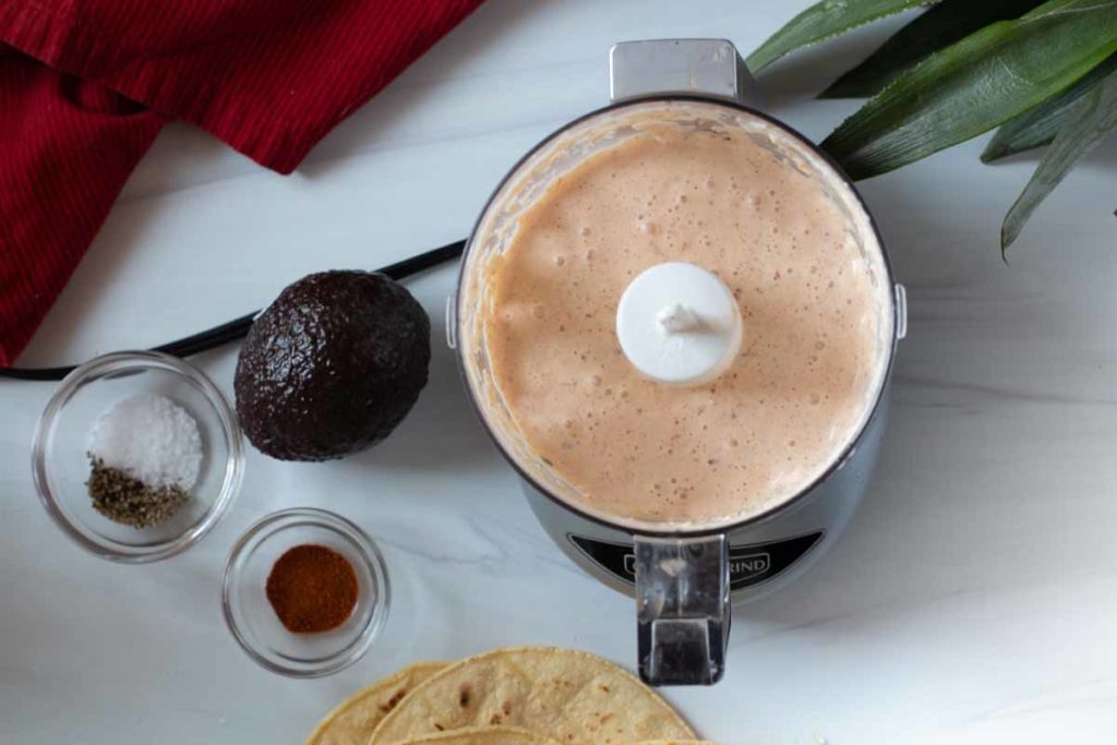 Using a food processor to make sauce for shrimp tacos.