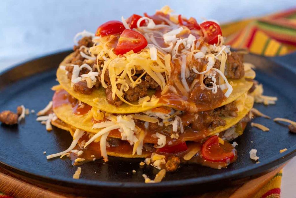 Stacked enchiladas ready to bake