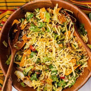 Original taco salad recipe made with catalina dressing in a wooden salad bowl.