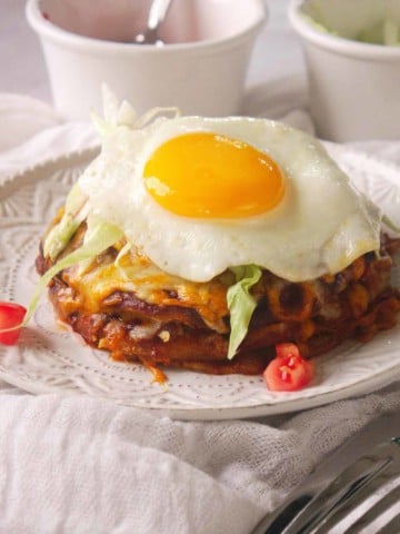 New Mexico Stacked Enchiladas topped with a fried egg.
