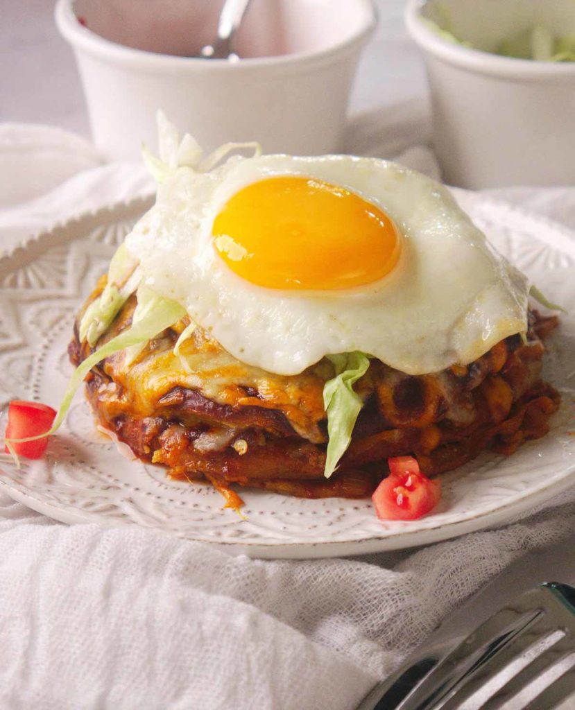 New Mexico Stacked Enchiladas topped with a fried egg.