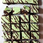 Chocolate mint brownies with green frosting and drizzled chocolate glaze