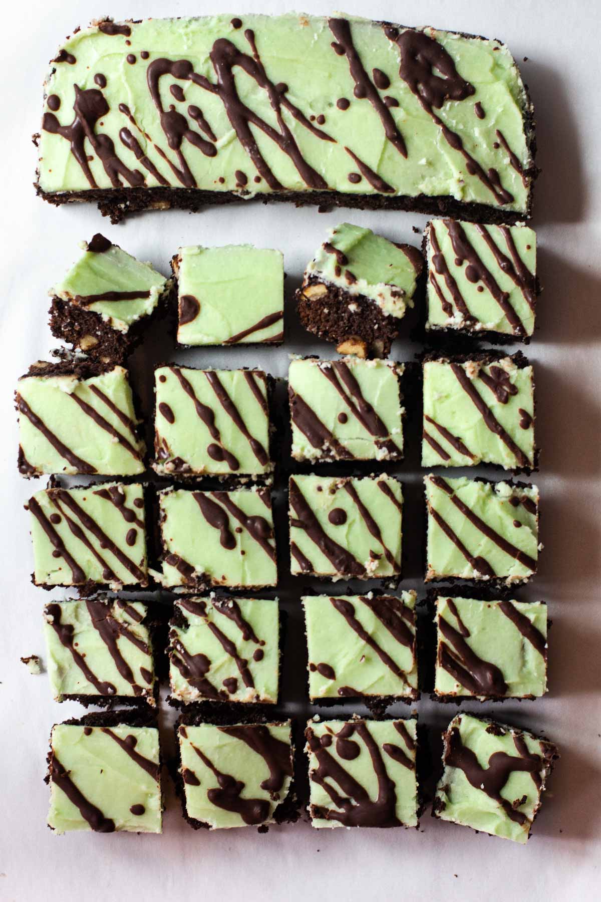 Chocolate mint brownies with green frosting and drizzled chocolate glaze