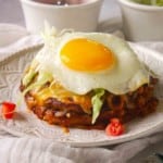 New Mexico Stacked Enchiladas topped with a fried egg.