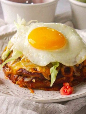 New Mexico Stacked Enchiladas topped with a fried egg.