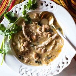 Rotisserie chicken soup served in a white bowl garnished with cilantro.
