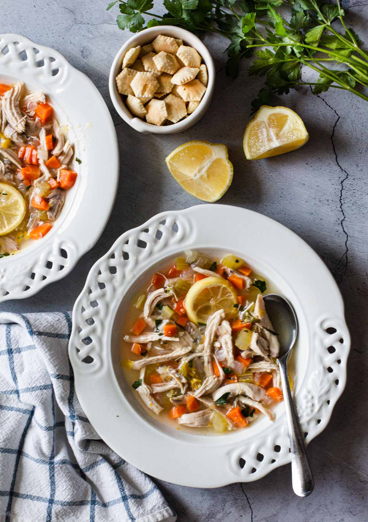 Lemon ginger chicken soup with a bowl of oyster crackers.