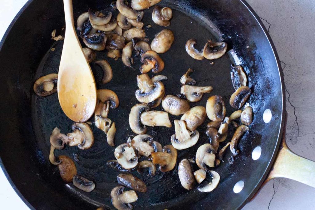 Frying mushrooms until crispy.